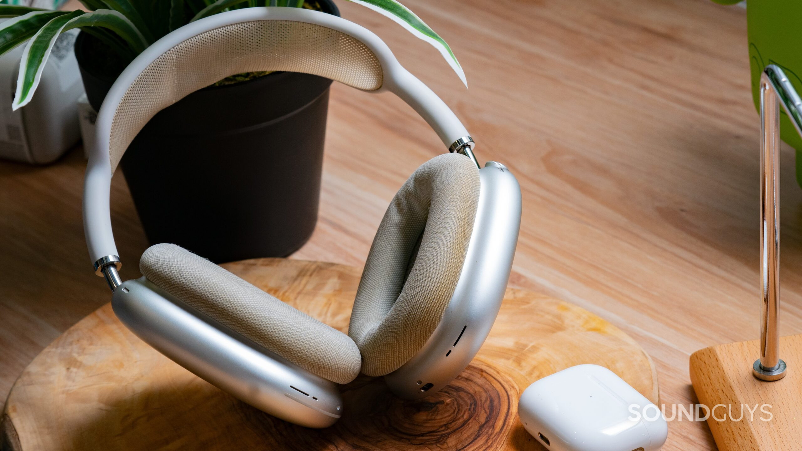 The AirPods Max next to the AirPods Pro 2 case.