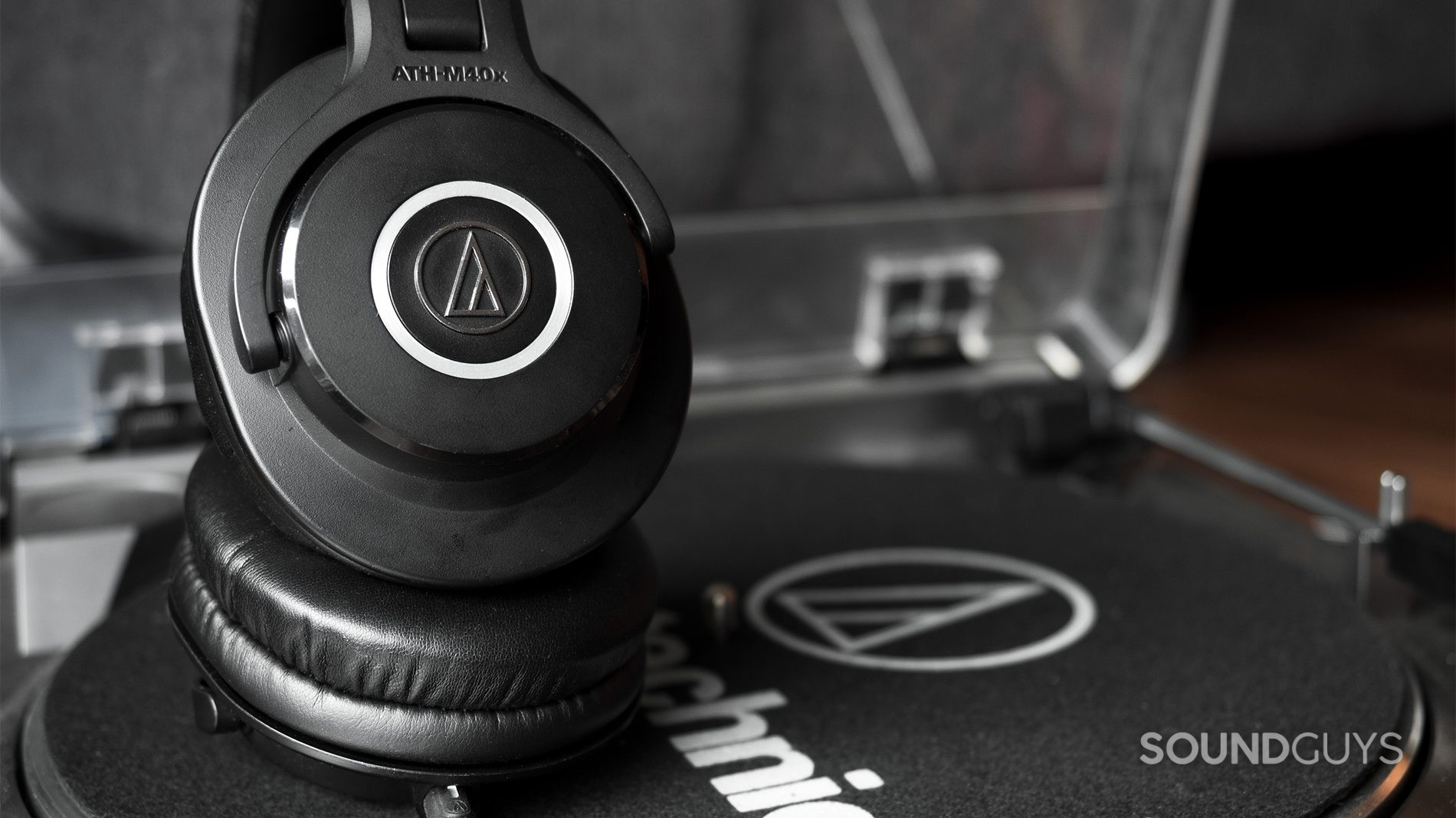 The Audio-Technica ATH-M40x wired studio headphones on an Audio-Technica turntable.