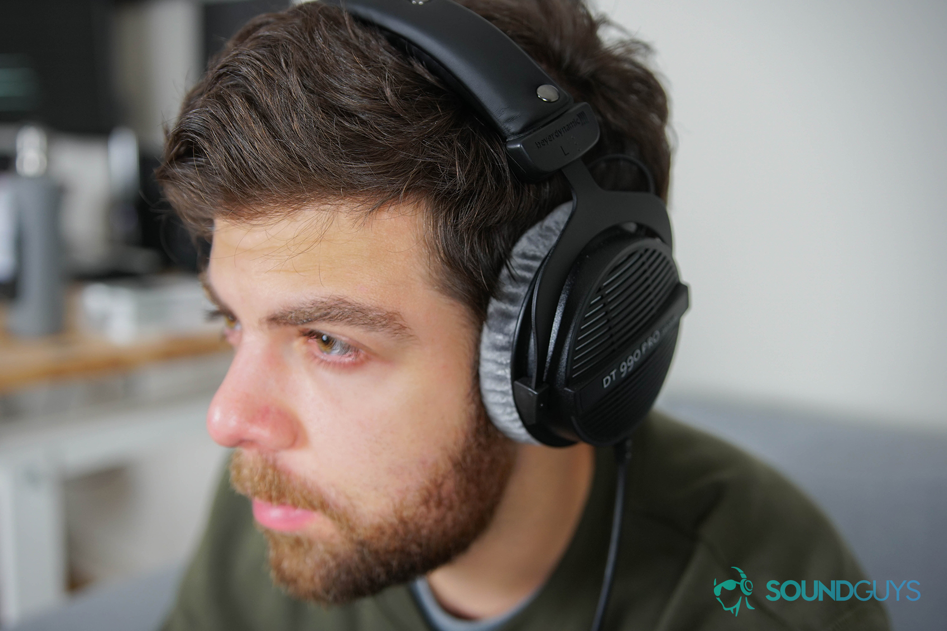 Best headphones under $200: The Beyerdynamic DT 990 Pro being worn by Adam Molina.