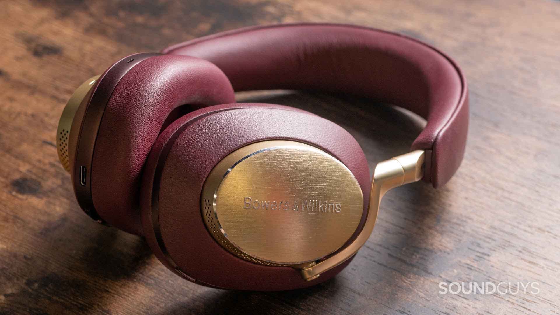 A photo of the Bowers &amp; Wilkins Px8 sitting atop a wooden counter.