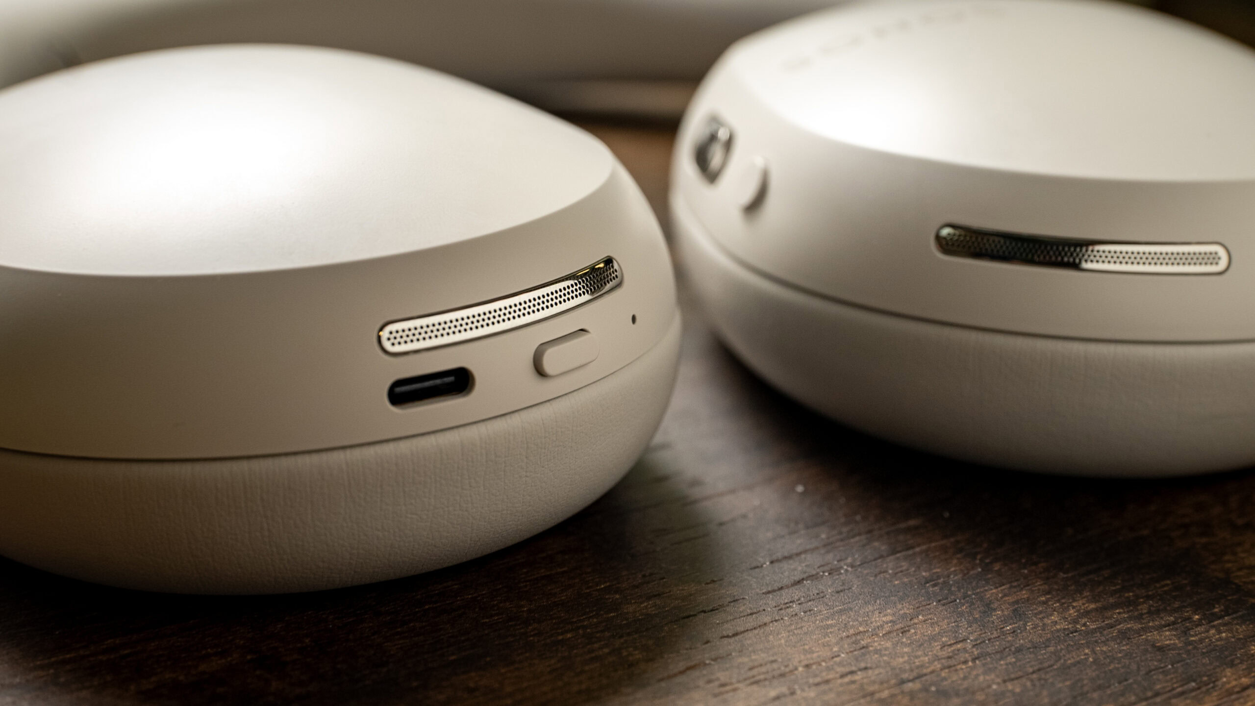 Close-up photo of the microphone array, USB-C port, and power/Bluetooth pairing button of the Sonos Ace headphones