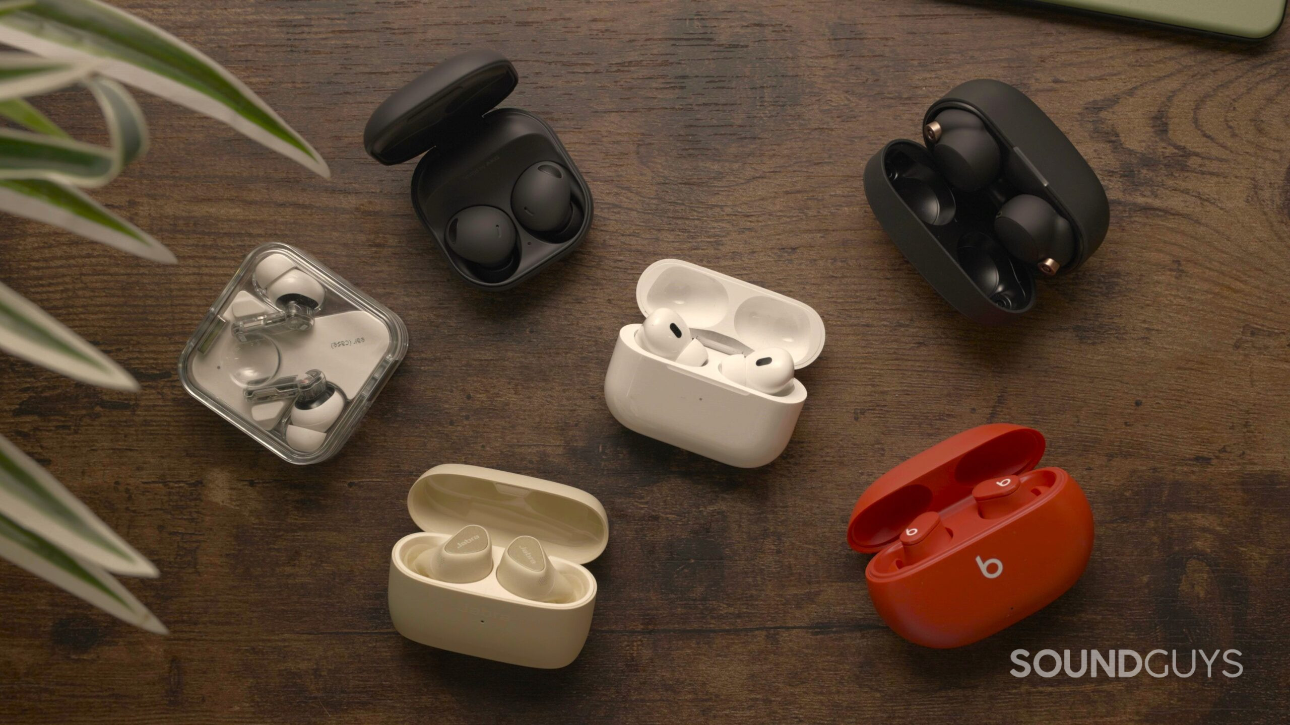 The best wireless earbuds on a wooden surface.