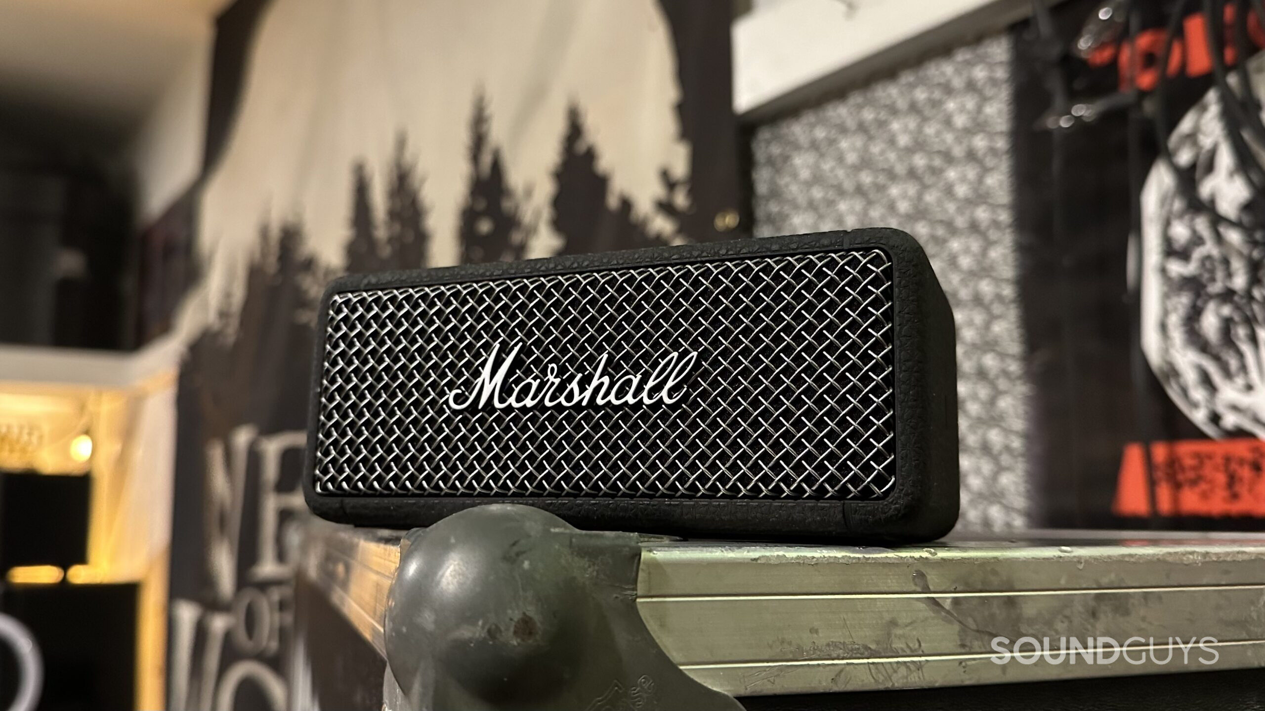 A Marshall Emberton II Bluetooth speaker placed on a road case.