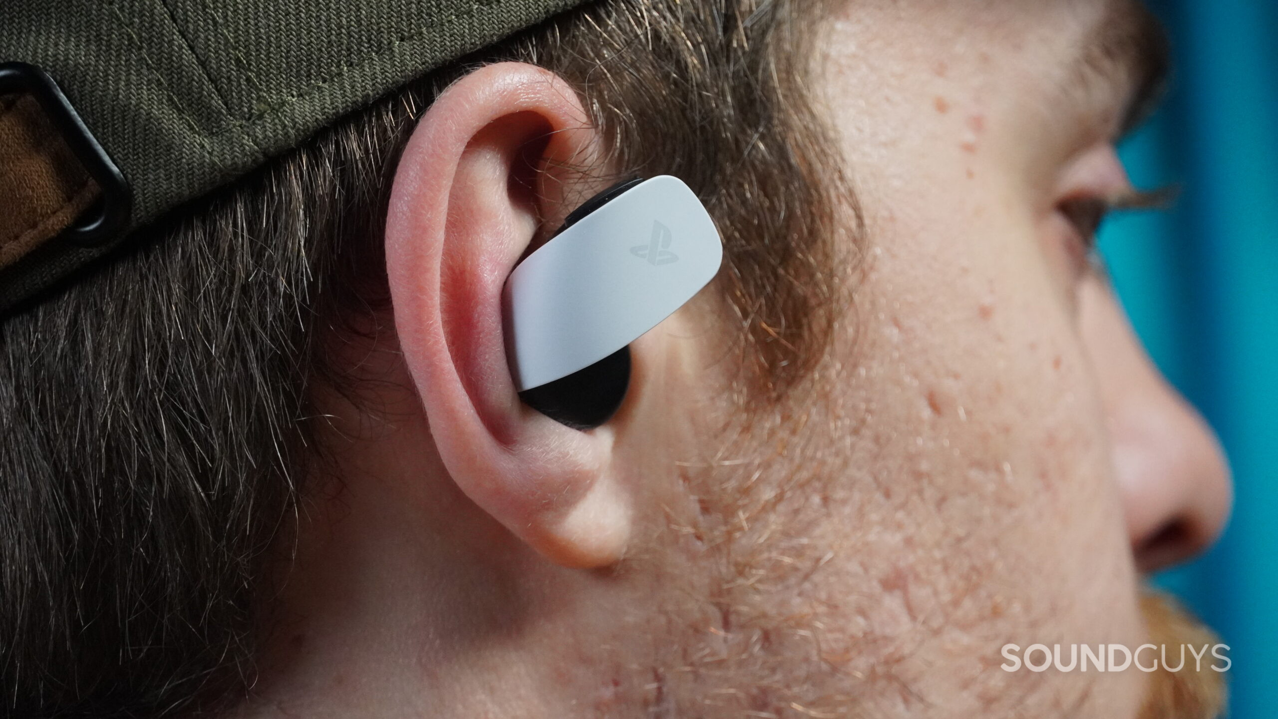 A man wears the Pulse Explore earbuds.