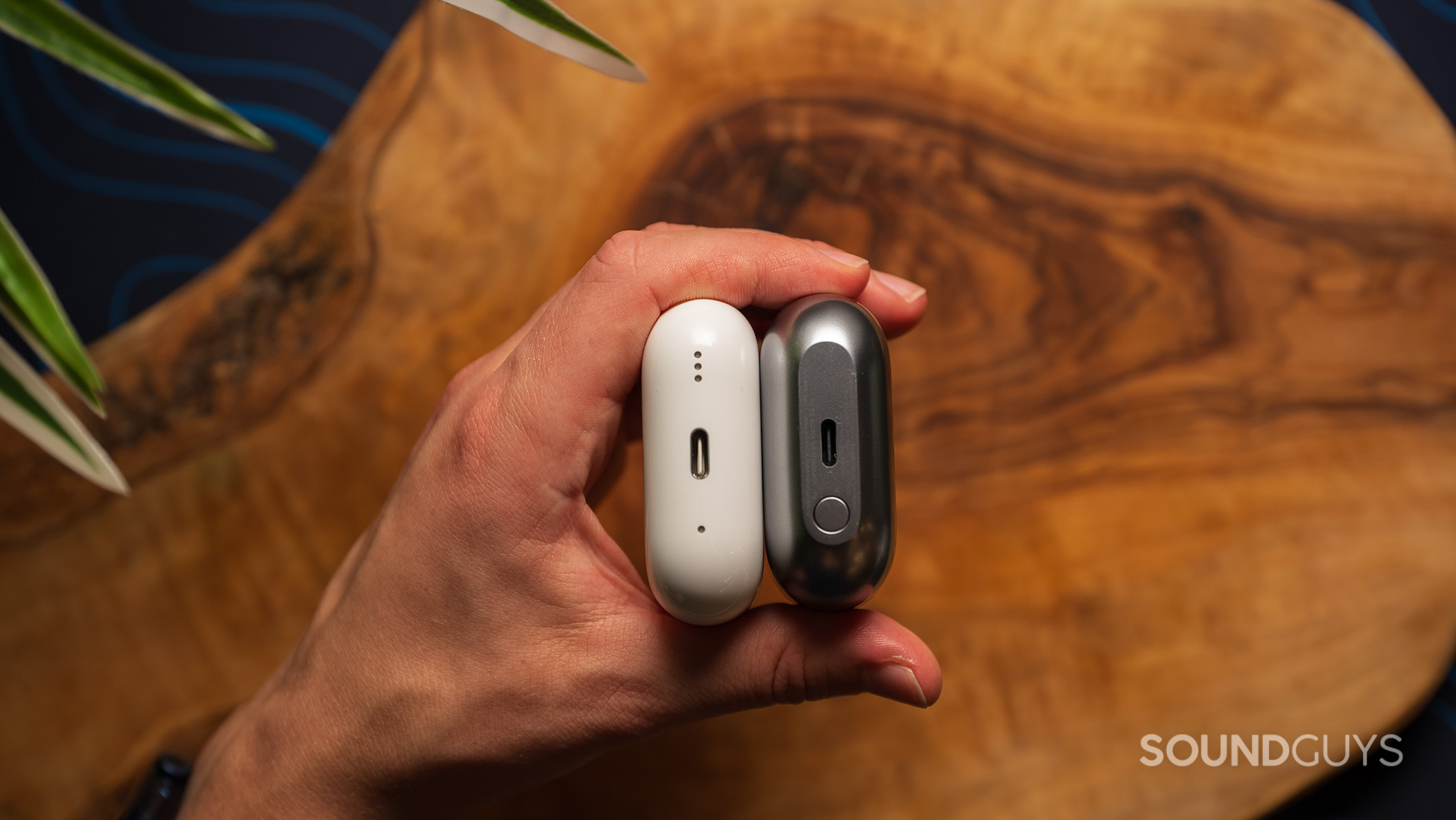 Samsung Galaxy Buds3 Pro next to the Apple AirPods Pro (2nd generation), showing the USB-C charging port on both. 