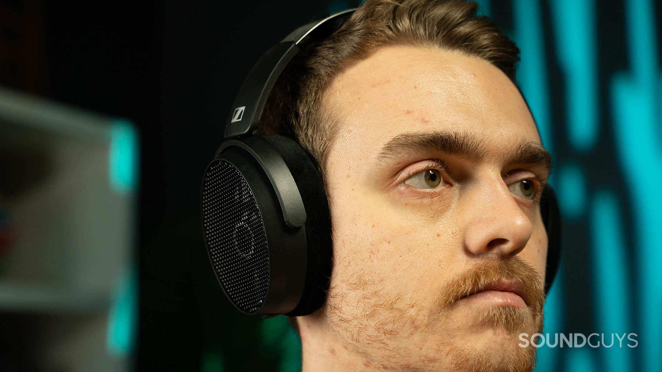 A man wearing the Sennheiser HD490 PRO headphones.