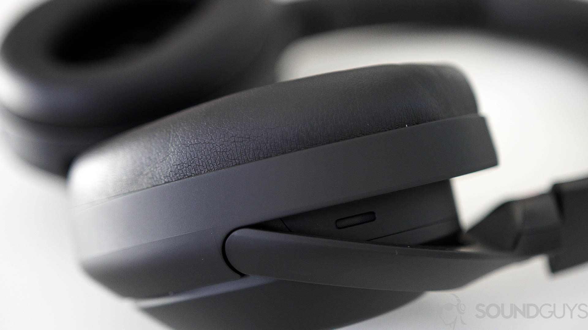 Shot of the earcups and the padding on the Sony WH-1000XM4 headphones on a white table. 