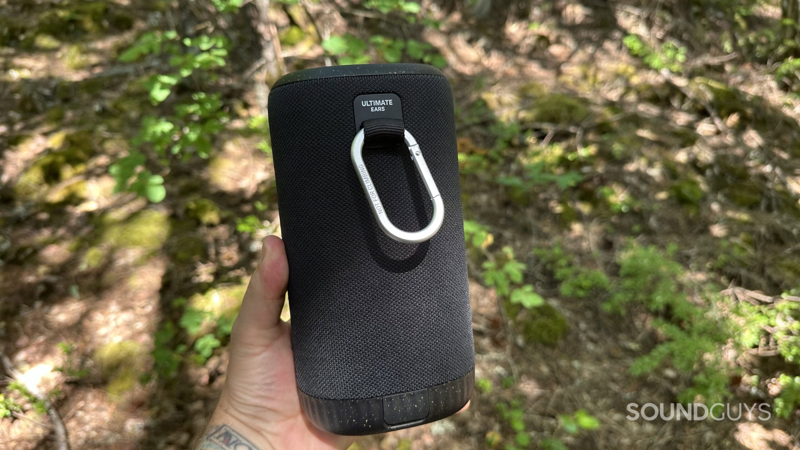 A photo showing the backside of a UE Everboom speaker, including it's carabiner for placement options.