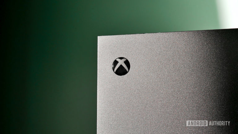 The Xbox Series X/S in grey against a green background.